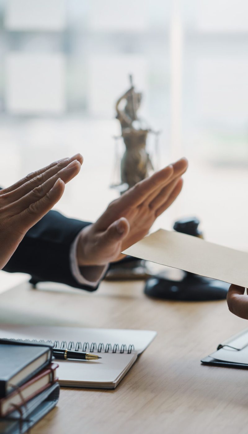 Lawyer refuses to accept bribe from business people in contracting. Corruption and anti bribery concept.